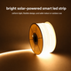 Tira LED COB solar blanco cálido brillante enrollada en un carrete con iluminación uniforme y continua