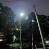 Commercial solar flood light system components showing the LED lamp, solar charging panels and mounting hardware