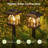 Set of decorative house-shaped solar pathway lights arranged for outdoor use along lawns, paths and garden borders