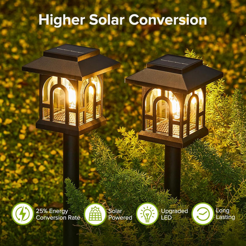 Set of decorative house-shaped solar pathway lights arranged for outdoor use along lawns, paths and garden borders