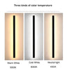 IP65 outdoor LED wall light casting a modern vertical beam effect on an exterior wall at night