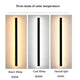 Luz LED exterior de pared IP65 creando de noche un efecto de haz vertical moderno sobre una pared exterior