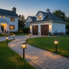 Mini house-shaped solar pathway lights lining walkway to detached garage