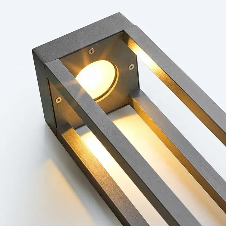 Outdoor LED bollard light detail showing the surface-mount base for secure installation beside walkways and landscaped areas