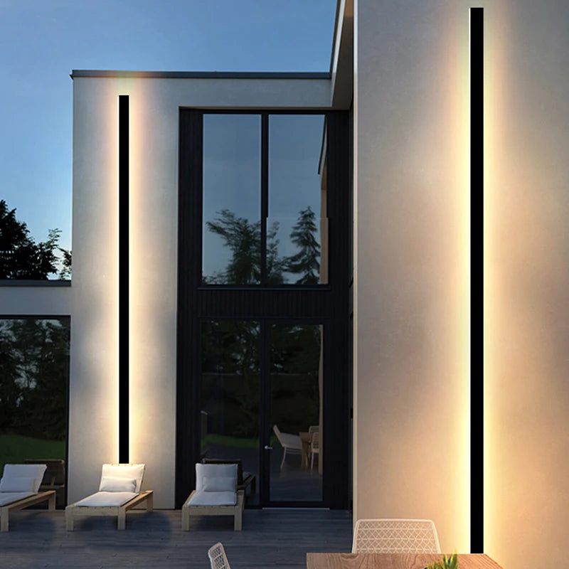 Side view of a linear outdoor LED wall light showing its shallow profile and wall-mount structure