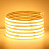 Coiled Premium Smart solar COB LED strip emitting bright, continuous warm white light through a clear protective sleeve