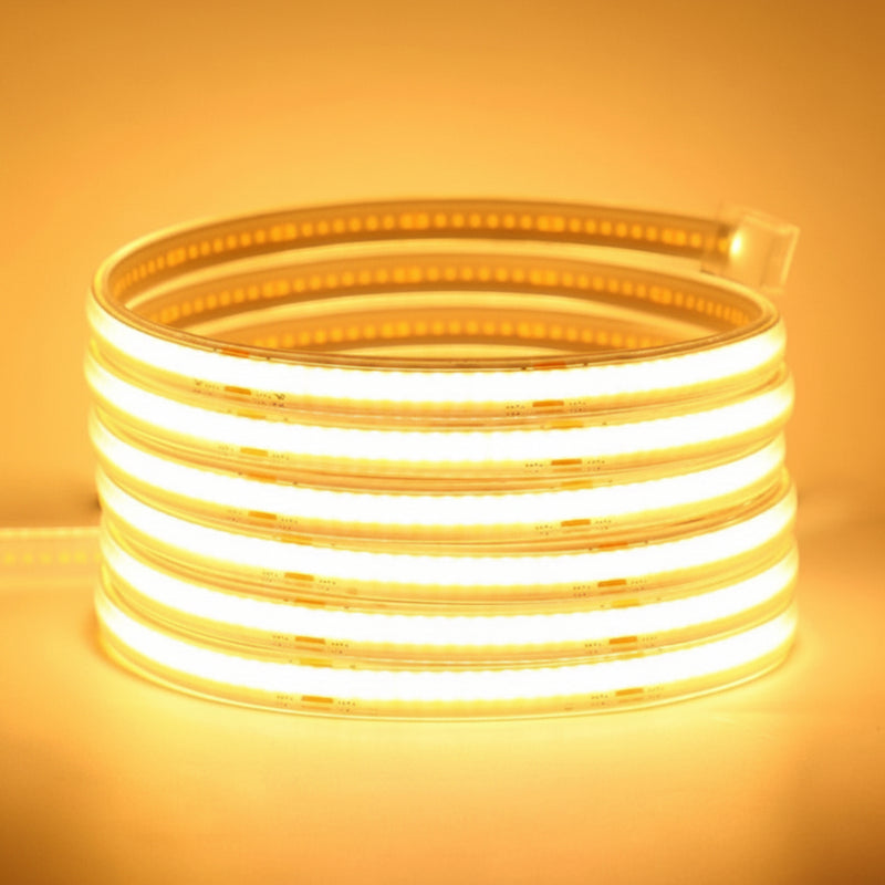 Coiled Premium Smart solar COB LED strip emitting bright, continuous warm white light through a clear protective sleeve | NoxLumin