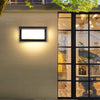 Solar wall light used around a residential address or house-number area to improve nighttime visibility