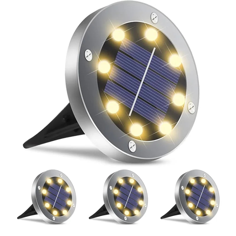 Round solar disk pathway light shown with its removable ground stake for simple flush installation in soil