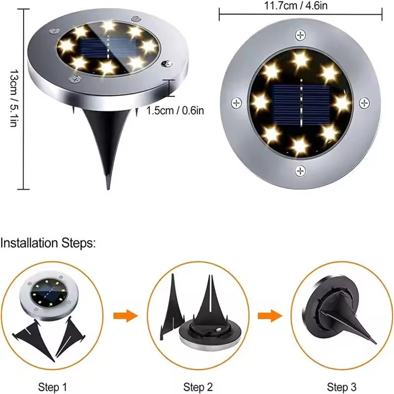Close product view of a round solar disk light showing the stainless steel top, LED ring and integrated solar panel