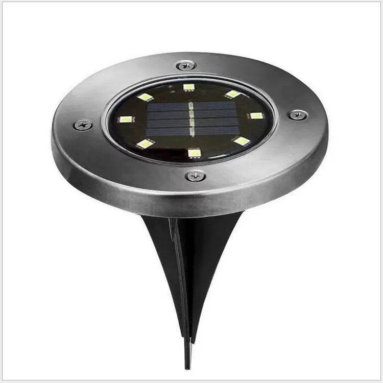Round solar pathway disk light product view with a compact stainless steel housing and in-ground stake for outdoor use