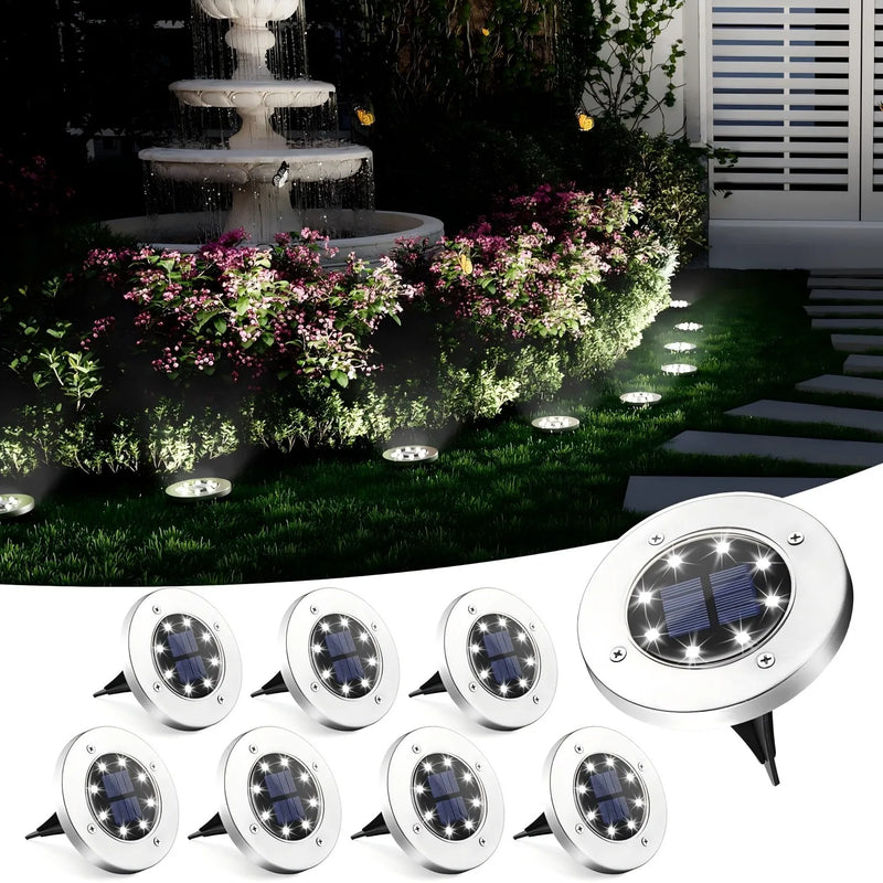 Multiple 8-LED solar disk pathway lights arranged as a set for larger garden, driveway and walkway lighting layouts