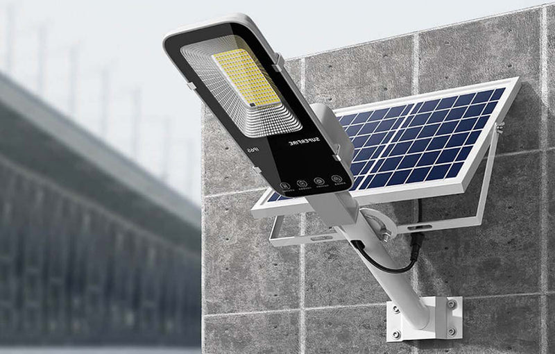 Solar flood light illuminating a broad outdoor area for nighttime visibility around a yard, driveway or building exterior