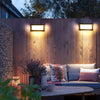 Solar motion sensor wall light used near a gate or walkway to provide automatic lighting when people approach
