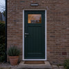 Solar motion sensor wall light installed above a residential front door at dusk