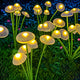 Solar mushroom and jellyfish garden stake light with translucent caps, flexible branches, side solar panel and ground stake