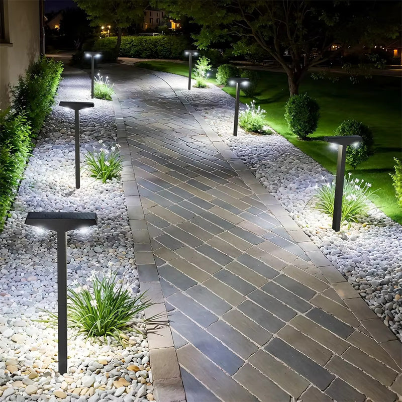 Solar pathway light graphic showing daytime charging and automatic illumination after dark for hands-free outdoor lighting