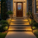 Luces solares para caminos como iluminación decorativa junto a escalones de entrada al anochecer
