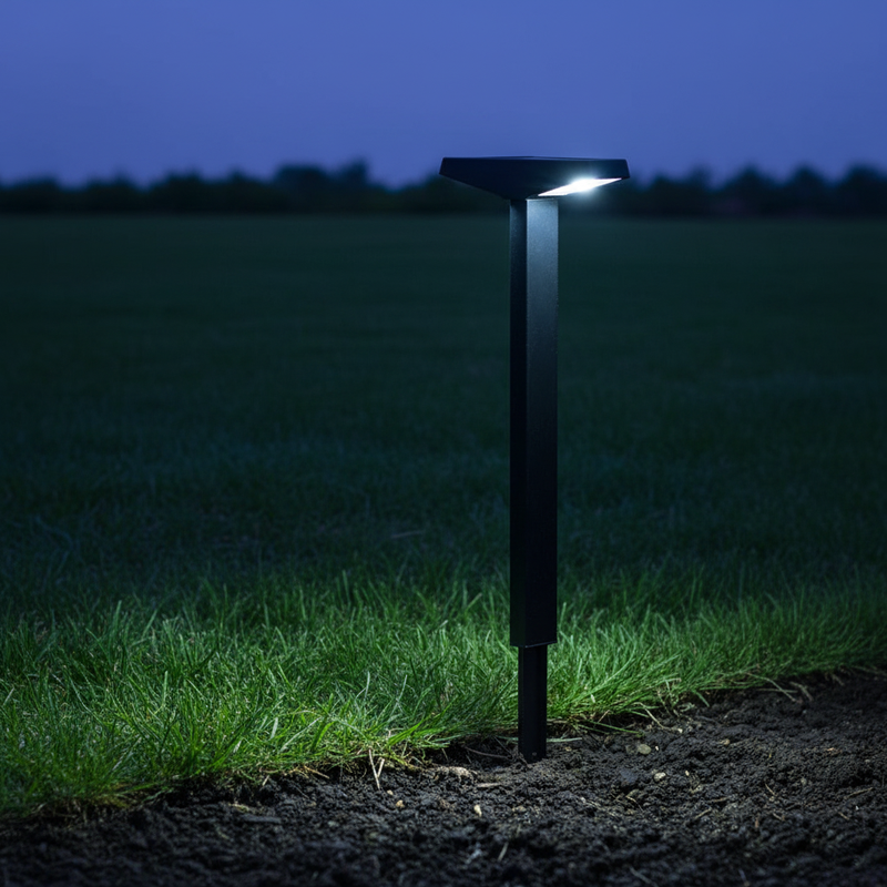 Solar pathway lights marking an outdoor garden route with soft downward illumination at dusk