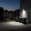 Split-design outdoor solar spotlight shown with its separate photovoltaic panel and connecting cable for remote panel placement