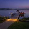 Solar spotlights illuminating dock pathway and waterfront