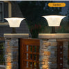 Solar wall sconce shown with remote control for selecting brightness and motion-sensor lighting modes