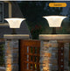 Solar wall sconce shown with remote control for selecting brightness and motion-sensor lighting modes