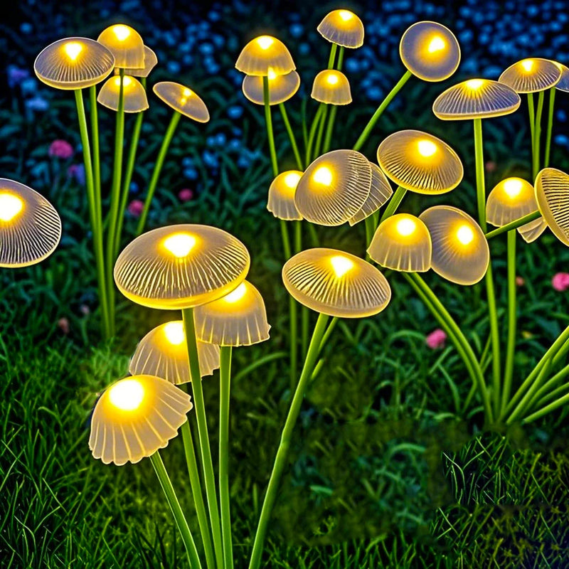 Close-up of Warm White solar mushroom garden lights glowing among plants