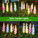 Solar delphinium flower lights displayed in garden, yard and lawn settings as decorative outdoor accents